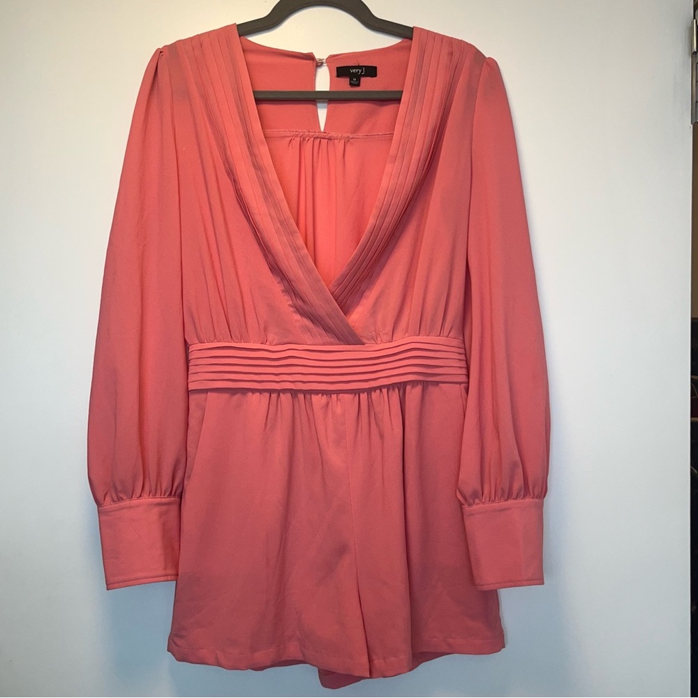 Very j- size medium. Lightly used pink romper